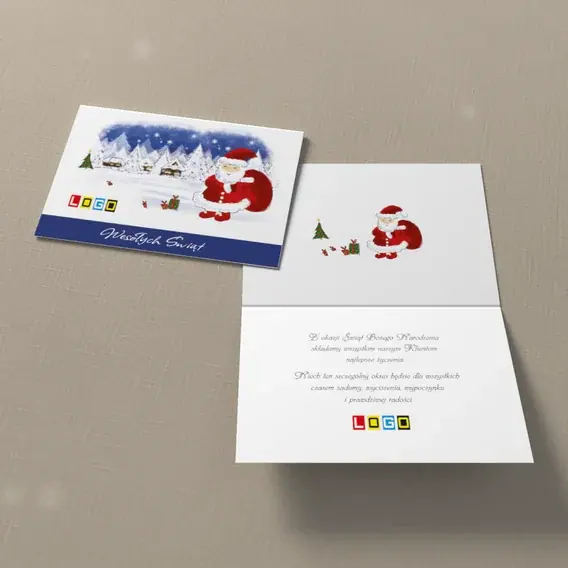 Kartka świąteczna z logo BN1-314 Mikołaj dźwiga paczki na śniegu, widok ogólny